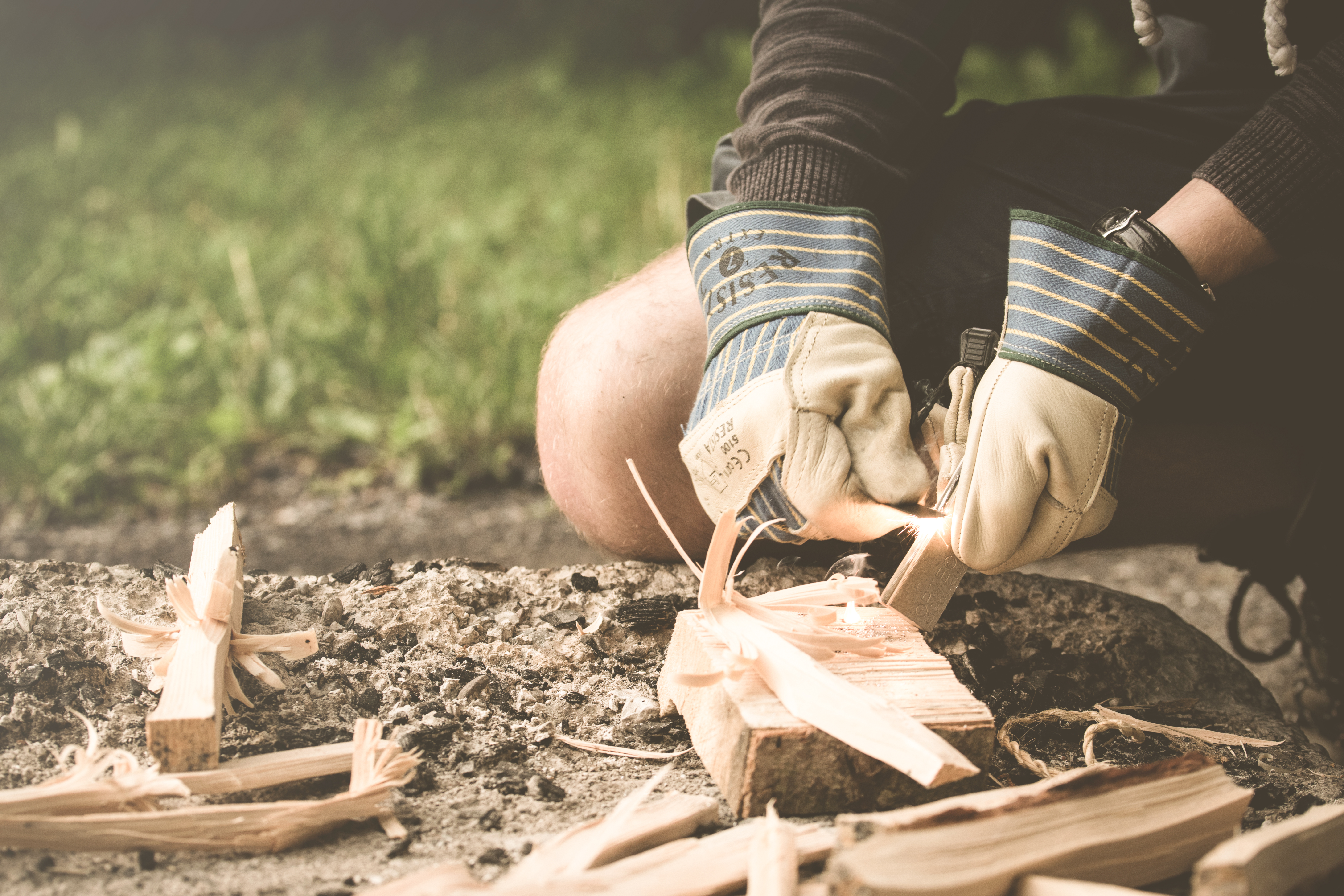 hand grass outdoor person wood photography summer spark spring firewood camping leisure outdoors ceremony relaxation tinder photograph experience adult bushcraft firerod starting fire survival skill 1001773